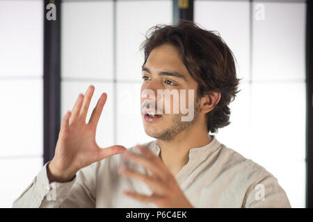 Close Up of Young Man Discussing and Moving Hands Stock Photo