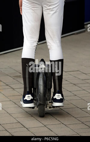 Doha, close up, human is on a monowheel on the road Stock Photo