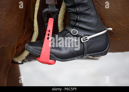 Doha, riding boots with spur in a safety platform Stock Photo