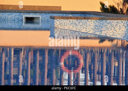 pool mirrored and reflected in its water Stock Photo