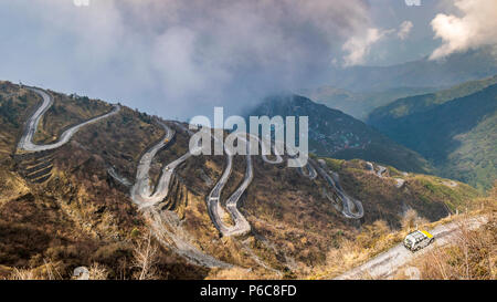 Three Level Zigzag road is probably the most dizzying road in the world. Located in the Sikkim Indian state, in the Himalayan mountains, the road incl Stock Photo