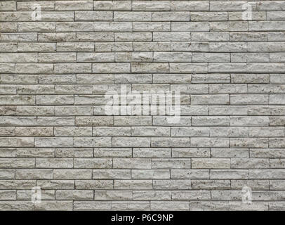 wall covered with clear porous tiles Stock Photo