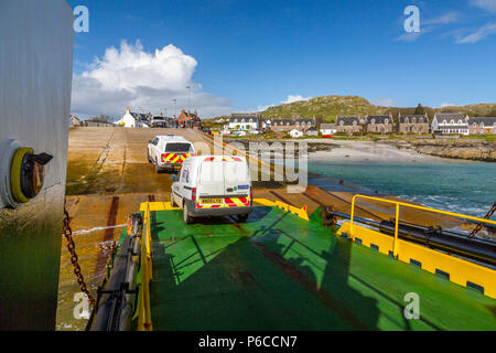 Vehicles leaving the Iona ferry ‘Loch Buie’ at Baile Mor pier, Isle of Iona, Argyll and Bute, Scotland, UK Stock Photo