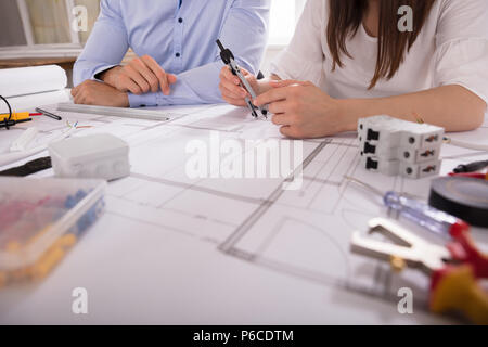 Two Architect Working With Work Tools Over Blueprint Stock Photo
