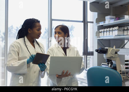 Two female scientists interacting with each other Stock Photo