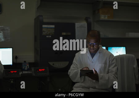 Scientist using digital tablet Stock Photo