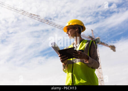 Female architect using digital tablet Stock Photo