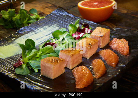 Slow Cooked Salmon fillet steak with salad on plate, Sous-Vide Cooking Salmon Fish. Stock Photo