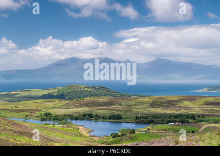 The magnificent Isle of Arran looking through a June heat haze that is sitting on top of the water Stock Photo