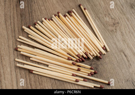 A pile of wooden safety long match sticks on wooden background Stock Photo