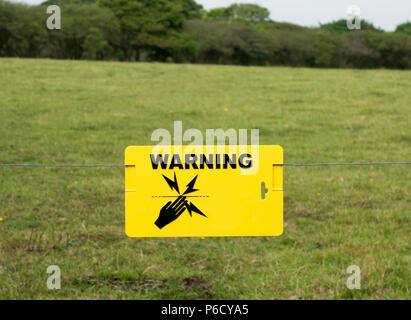 electric fence warning sign Stock Photo