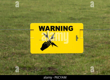electric fence warning sign Stock Photo