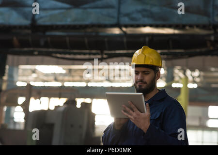 Technician using digital tablet Stock Photo