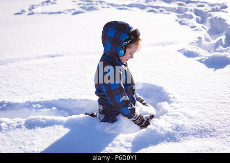 Cute girl playing in snow Stock Photo