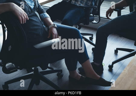 Business colleagues interacting with each other in a meeting Stock Photo