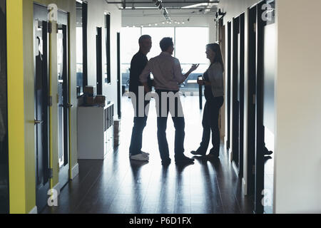 Business people interacting with each other Stock Photo