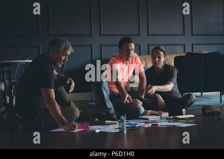 Business colleagues discussing over documents Stock Photo