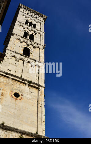Saint Micheal in Foro Church medieval romanesque bell tower, erected in the 13th century  in the city of Lucca, Tuscany (with blue sky and copy space) Stock Photo