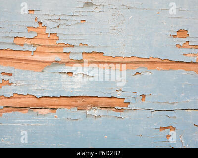 Wood with blue paint flaking off to use as background Stock Photo