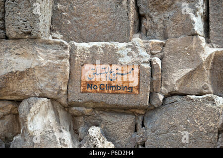Signs warn not to climb on the Great Pyramid of Giza (Pyramid of Khufu, Pyramid of Cheops) at Giza, Egypt. Stock Photo