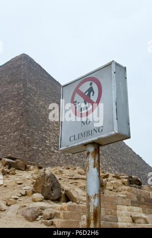 Signs warn not to climb on the Great Pyramid of Giza (Pyramid of Khufu, Pyramid of Cheops) at Giza, Egypt. Stock Photo