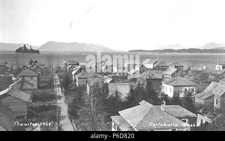 . English: View of Metlakatla, ca. 1912 . English: Most likely taken from the church bell tower. Cannery is visible on right side waterfront. Caption on image: Netlakatla, Alaska PH Coll 247.737 Metlakatla is located at Port Chester on the west coast of Annette Island, 15 miles south of Ketchikan. Metlakatla means 'saltwater channel passage' and was founded by a group of Canadian Tsimshians who migrated from Prince Rupert, British Columbia in 1887 seeking religious freedom. They were led by a Scottish lay priest in the Anglican Church (Church of England), Reverend William Duncan, who had begun Stock Photo