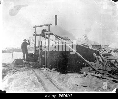 Mining operation showing boiler house and shaft, Yukon Territory, March ...