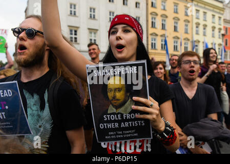 Krakow, Poland. 29th June, 2018. Hundreds of people attend a protest against the implementation of ACTA 2 ( Anti Counterfeiting Trade Agreement) in European Union. On June 20th, The Legal Affairs Committee of the European Parliament approved the draft directive on copyright on the digital market. The next vote will take place on  July 4th. The European Commission intends to introduce a new tool, allegedly to protect copyrights. Credit: SOPA Images Limited/Alamy Live News Stock Photo