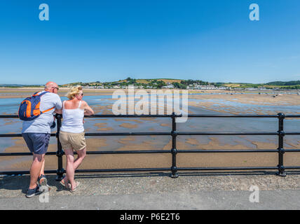 Devon, UK, 30 June 2018. UK Weather - Another hot and humid day in North Devon, as the heatwave continues, a couple enjoy a gentle breeze and the panoramic views over the Torridge estuary at Appledore. Stock Photo