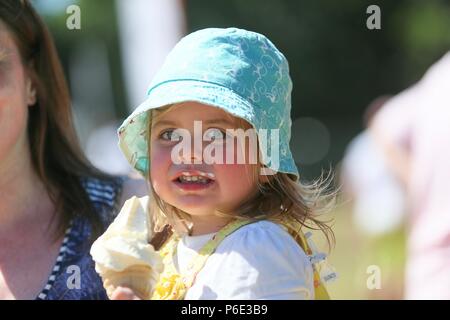 A little girl enjoying an ice cream UK Stock Photo