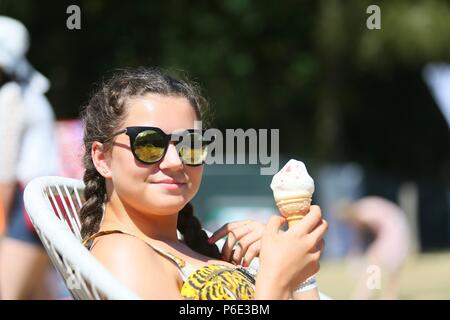 14 year old girl with an ice cream in summer. UK Stock Photo