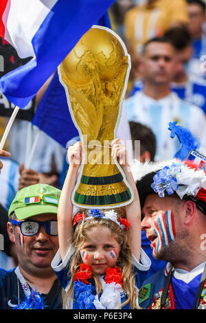A Fan Holds Up A Replica Of The FIFA World Cup Trophy While Waiting For a-fan-holds-up-a-replica-of-the-fifa-world-cup-trophy-while-waiting-for