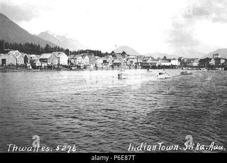 . English: Sitka from the water, ca. 1914 . English: Caption on image: Indian Town, Sitka, Aaa . PH Coll 247.694 Subjects (LCTGM): Sitka (Alaska); Cities & towns--Alaska; Boats--Alaska--Sitka; Dwellings--Alaska--Sitka; Piers & wharves--Alaska--Sitka  . circa 1914 75 Sitka from the water, ca 1914 (THWAITES 291) Stock Photo