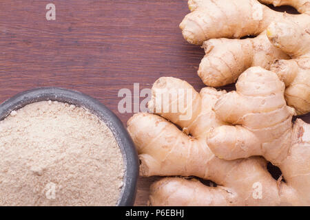 Roots and ginger powder on the table, top view Stock Photo