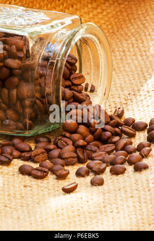 Roast coffee beans on burlap Stock Photo