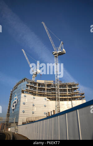 High rise crane seen here working construction building site in Leeds, Yorkshire Stock Photo