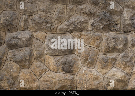 Old stone wall as texture or background. Old exterior wall with big rocks Stock Photo