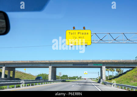 Florida,Fort Ft. Pierce,Florida Turnpike toll road plaza,distance information sign,roadway,highway,traffic,overpass,bridge,FL171028017 Stock Photo