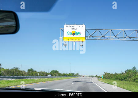 Florida Turnpike highway toll booths with SunPass lanes during the ...