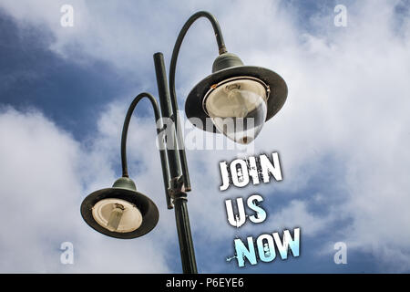 Text sign showing Join Us Now. Conceptual photo Enroll in community Register in website or form Recruit Double Light post sky enlighten ideas message  Stock Photo
