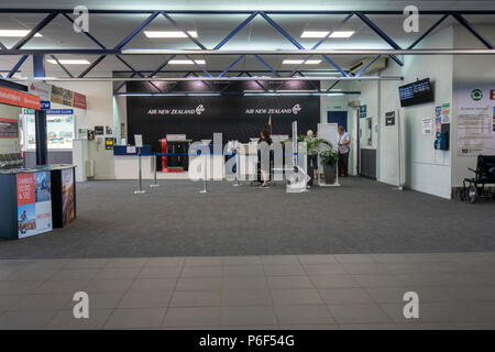 Tauranga New Zealand - January 16, 2018: Inside tauranga airport showing checkin counters with few people Stock Photo