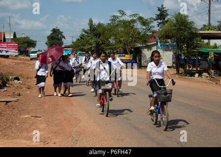 Thakhek, Laos - November 05, 2014: Midddle school Laos students in the uniform are heading back home from school in the rural area of Thakhek, Laos Stock Photo