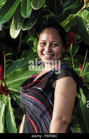 Beautiful sexy happy smiling tropical polynesian woman in blue bikini