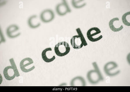 word code  printed on white paper macro Stock Photo