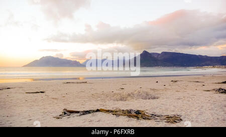 Dramatic sky at sunset on Noordhoek Beach in Cape Town South Africa Stock Photo