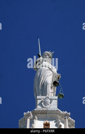 Goddess of Justice, statue at the top of Doge Palace in Venice, holding balance scales and sword, erected in 1579, Venice, Italy Stock Photo