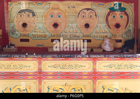 vintage fairground throw a ball in the mouth game Stock Photo