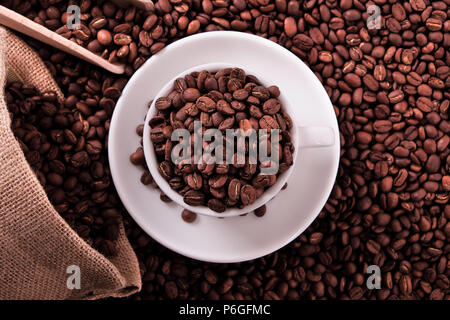 White coffee cup with beans sack and scoop Stock Photo