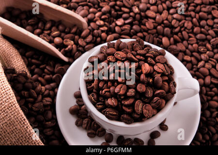 White coffee cup with beans sack and scoop Stock Photo