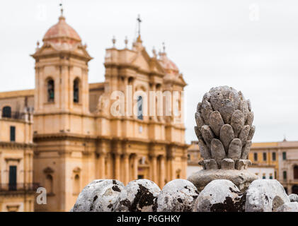 Baroque ornament in Noto (Sicily, Italy); in the background blurred view of the cathedral Stock Photo